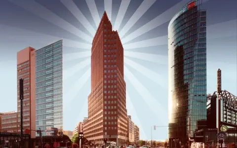 Moderne Hochhäuser am Potsdamer Platz, Berlin. Ein roter Backsteinturm und ein gläserner Turm ragen in den Himmel. Ein toller Panoramapunkt Berlin.