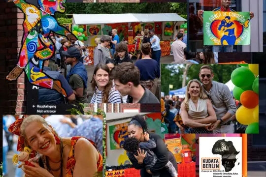 Bunte Kunstfigur und fröhliche Menschen beim **Carnival Berlin**. Ein Mann hält ein Plakat mit der Aufschrift "Danza de Coração".
